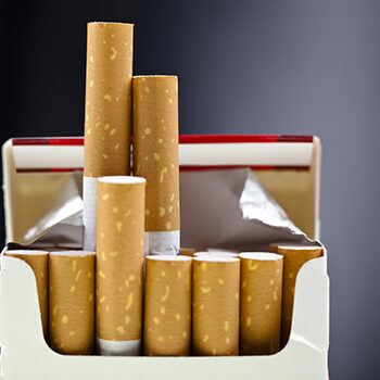 An Up Close View Of A Package Of Several Cigarettes
