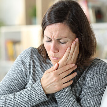 Middle Age Woman Suffering Toothache At Home